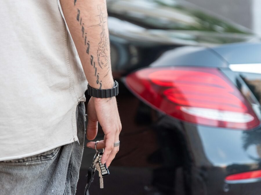 Photo of hands, keys, and car