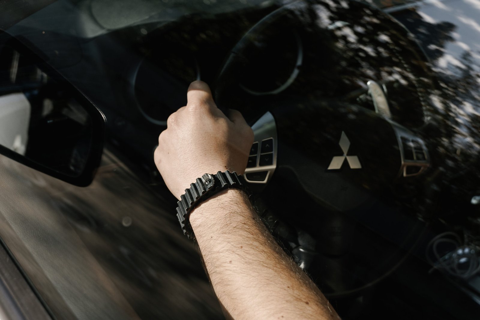 belt2belt Driver's hand on steering wheel
